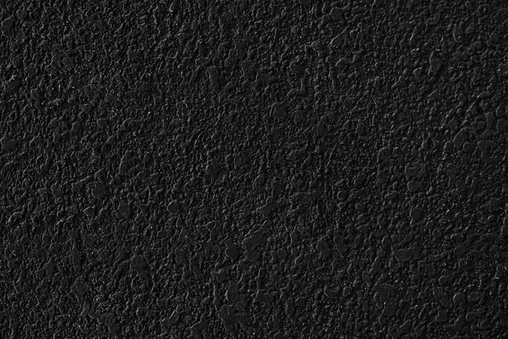 black textured wallpaper that looks like it could be used as a background or backdrop