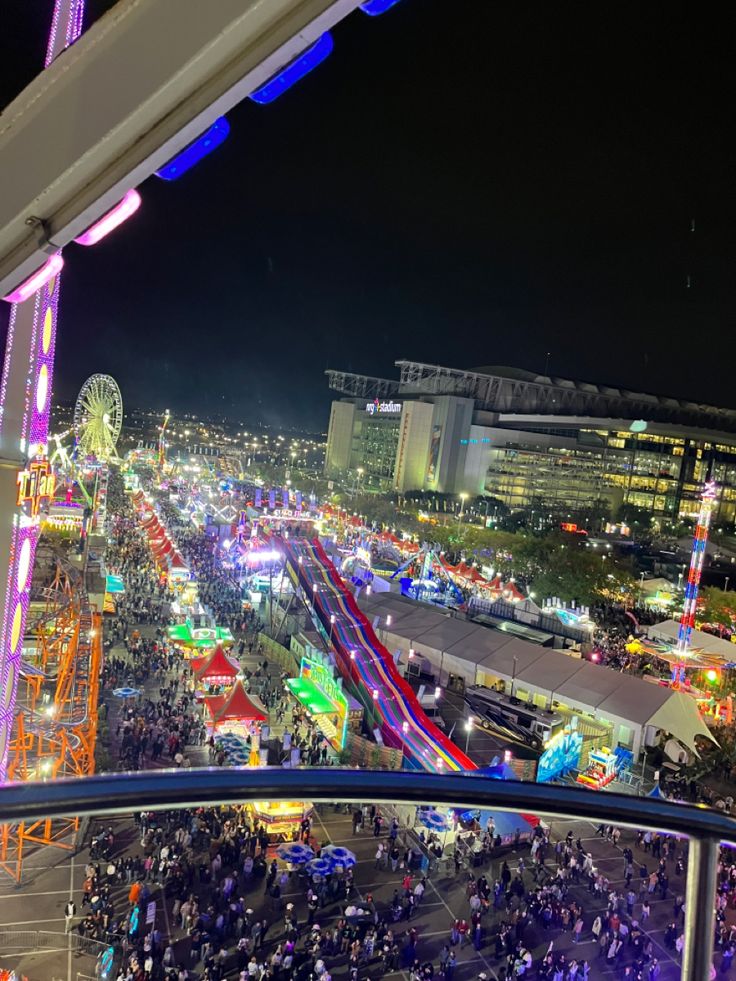 an aerial view of a carnival at night