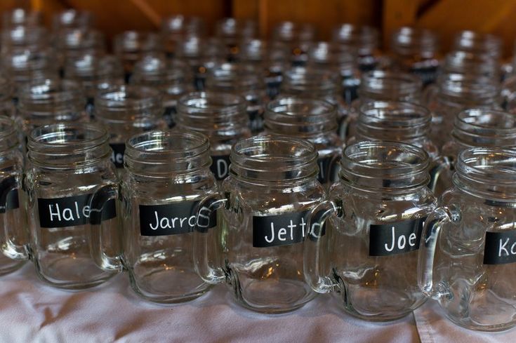 there are many jars with name tags on them