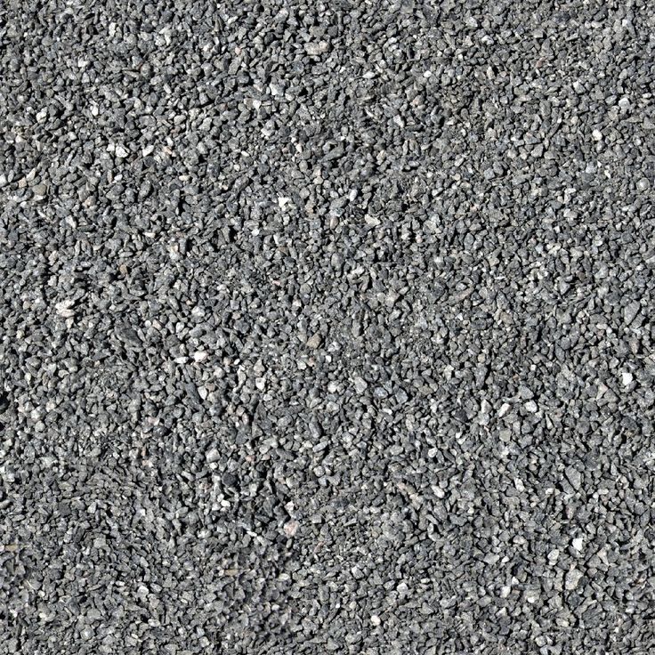 the texture of an asphalt surface is shown in grey and gray tones, with small rocks on top