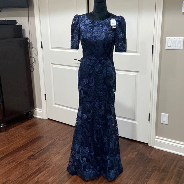 a dress on display in front of a door