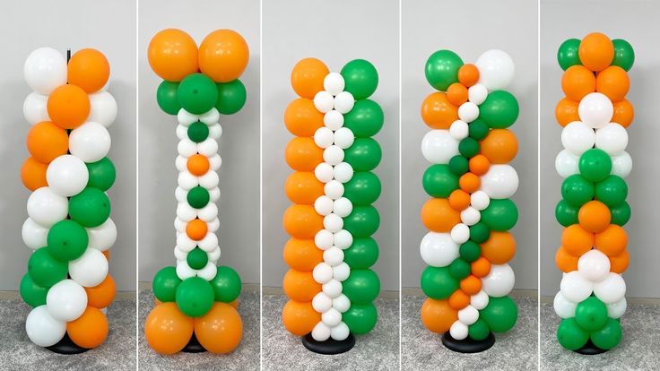 balloons are arranged in the shape of letters with green, white and orange balls on them