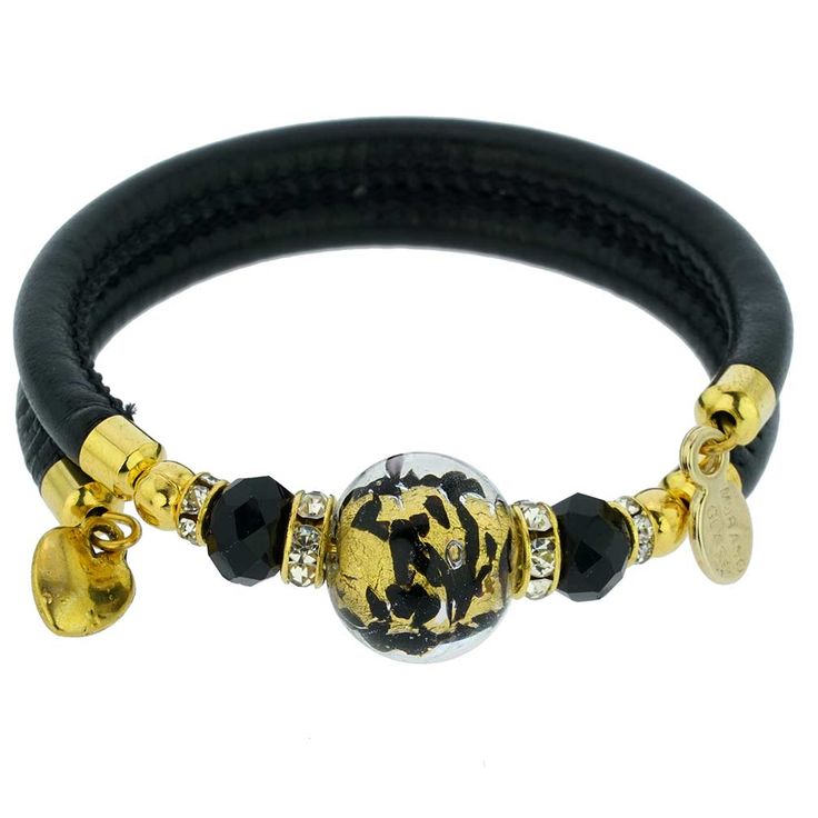 Adorn your wrist with this lovely Murano Glass bracelet - a fine token of Venice with its glamour, elegance, and charm. A high-quality textured black leather band complements a stunning 24K gold-lined finely crafted Murano Glass bead in the center. This Venetian bracelet is handmade in a small Murano Glass workshop in Venice, Italy by experienced artisans who use only basic tools to shape glass beads under a small flame, as was the Venetian custom for a thousand years. This radiant Murano bracel Elegant Leather Bracelets With Gold Clasp, Luxury Gold Leather Bracelet Adjustable, Luxury Gold Leather Bracelet With Adjustable Fit, Elegant Leather Bracelet With Gold Clasp, Luxury Gold Adjustable Leather Bracelet, Yellow Gold Leather Bracelet Gift, Yellow Gold Leather Bracelets For Gift, Yellow Gold Leather Bracelet As Gift, Modern Gold Bracelets With Black Enamel