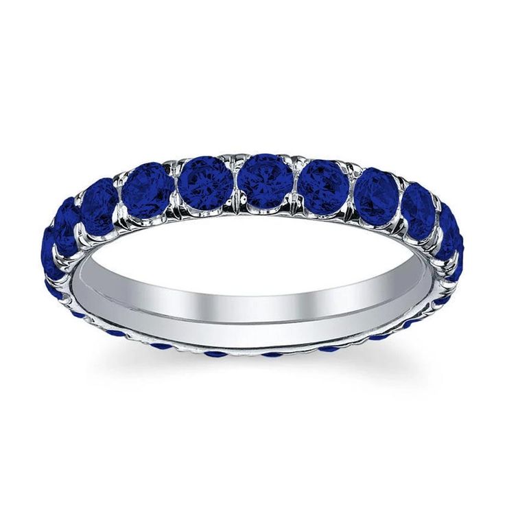 Someone with a September birthday will delight in this token of true friendship, sincerity, and devotion when you give this to them as a gift. An eternity ring is stackable and can represent a number of things such as a child, the bearer, a spouse, or can simply be a ring of a person's favorite gemstones. The deep blue sapphire gemstones represent honesty and wisdom which makes an eternity ring crafted with them a great gift idea for a college graduate. 1.50 cttw in AAA quality natural gemstones are u-pave set into this eternity ring in an elegant way that is sleek and beautiful. Product Information Metal: Gold or Platinum Setting: U-Pave Width: 3mm Gemstone Information Total Carat Weight: 1.50 cttw Quality: AAA Shape: Round No. of Stones: Approx. 24 College Graduate, September Birthday, True Friendship, Ring Crafts, Pave Setting, Simply Be, Sapphire Gemstone, The Deep, Eternity Ring