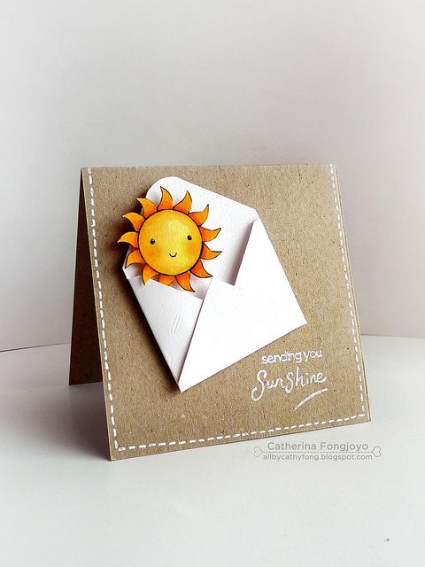 a card with an envelope and a sun on it