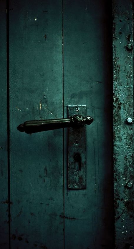 an old door with a handle on it