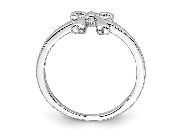 Rhodium over sterling silver children's polished finish bow ring. Band width measures approximately 1/16". Adjustable Silver Butterfly Ring For Formal Occasions, Adjustable Formal Butterfly Ring, Formal Adjustable Butterfly Ring, White Gold Bow Rings For Anniversary, Adjustable Anniversary Ring With Bow Detail, Classic Silver Jewelry With Bow Detail, Classic Silver Jewelry With Bow, Adjustable Bow Ring For Anniversary, Kids Rings