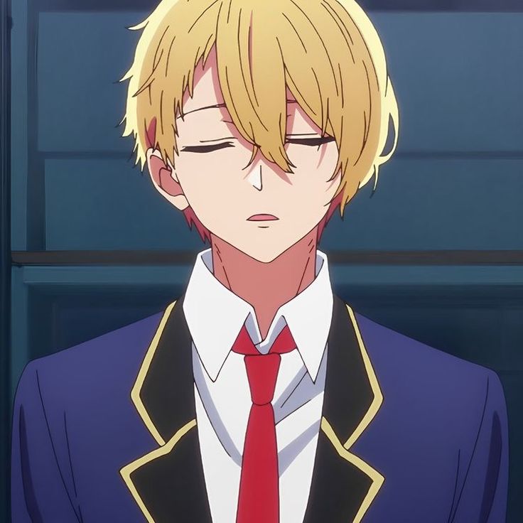 an anime character with blonde hair wearing a suit and tie, looking at the camera