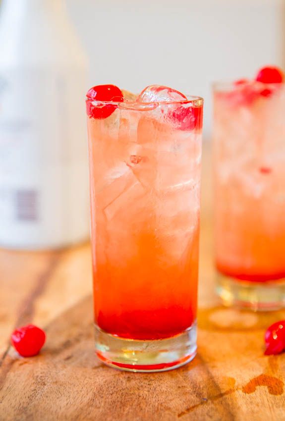 a close up of a drink in a glass on a table