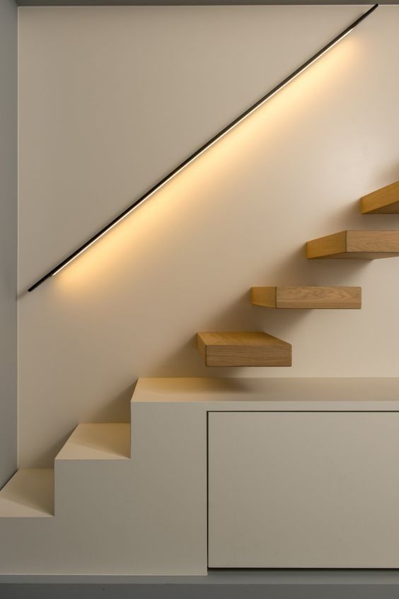 the stairs are made of wood and have lights on them