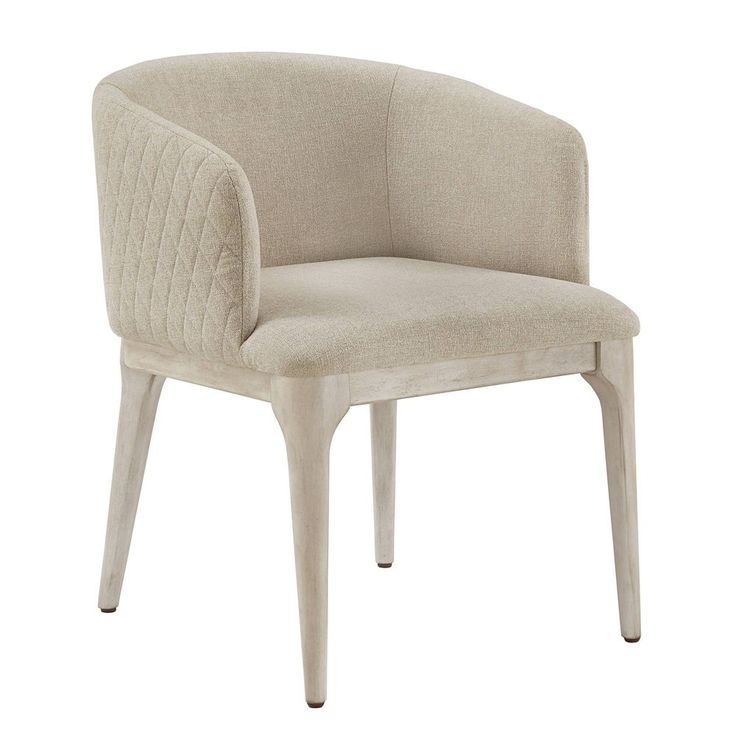 an upholstered chair with wooden legs and a beige fabric seat pad on the back