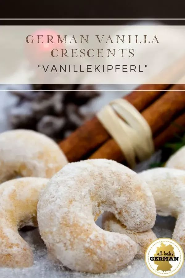 some sugared doughnuts and cinnamon sticks on a table