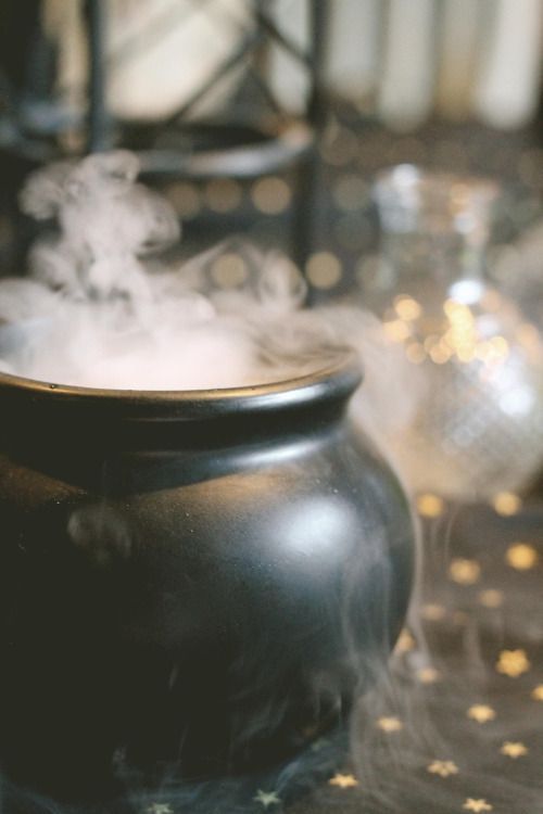 a black pot with steam coming out of it