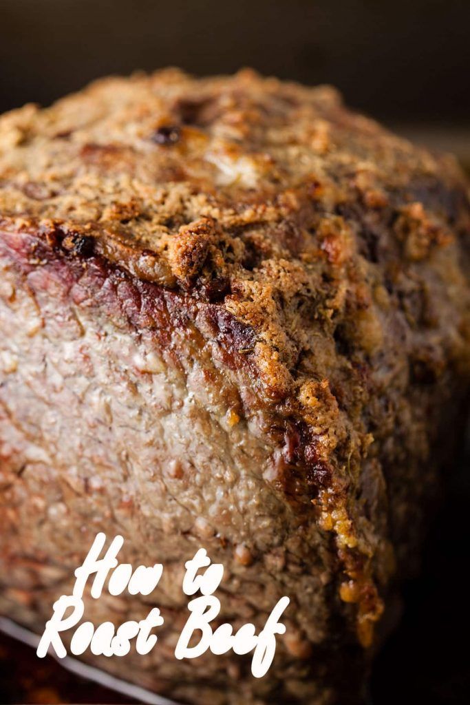 a close up of a loaf of bread on a plate with the words how to roast beef