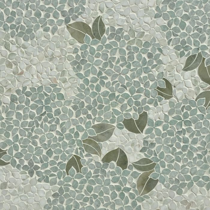 an artistic tile design with leaves on it