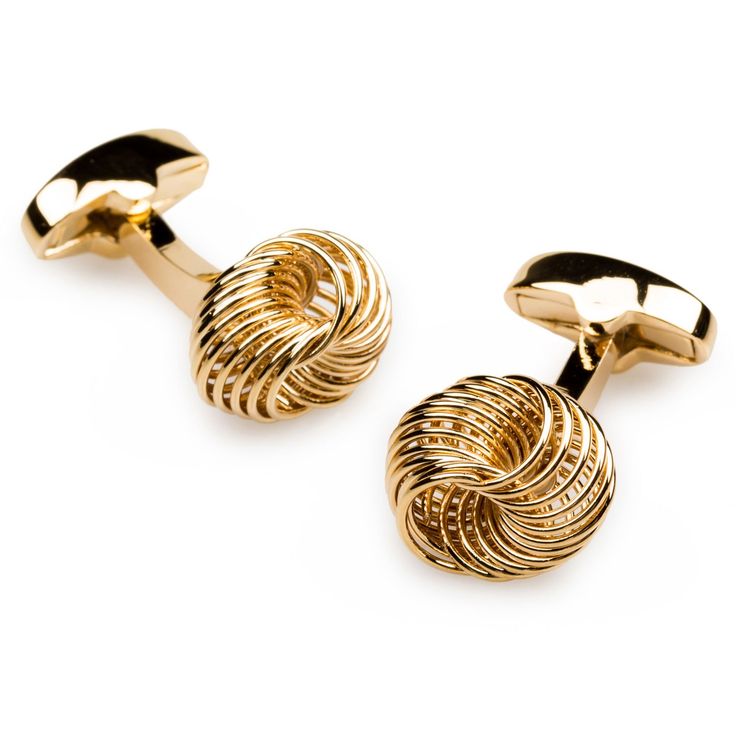 two gold toned cufflinks with twisted design on each end, one in the shape of a knot