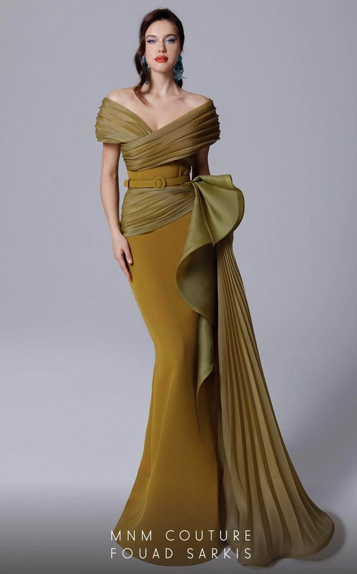 In this MNM COUTURE 2692 creation, ascend to a whole new level of sophistication. This gown has fine pleats on panels that wrap into a surplice design. Structured with an off shoulder neckline on a corset defined bodice and nipped with a tonal belt, the waist is graced with a voluminous ruffle at one side. Pleats drape the skirt, forming a mermaid silhouette with a cascading sash and a sweeping train. Make your presence known in this MNM COUTURE masterpiece. Models are wearing the Fuchsia, Olive Olive Gown, Plus Size Gowns Wedding, Fouad Sarkis, Mnm Couture, Off Shoulder Gown, Mermaid Evening Gown, Plus Size Gowns, Ladies Gown, Mermaid Fashion