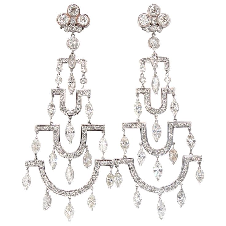 The Art Deco Edge. The classic long chandelier earrings. 16.00cts of natural round diamonds: G/H-color, Vs-2 & si-1 clarity. 14kt. white gold 34.7 grams. Earrings measure: 3.80 Inch Length Lower Tier: 1.54 inch upper tier: .60 icn. Comfortable Omega closure $67,000 Appraisal Certificate to accompany Dangle Art, Pink Pearl Bracelet, Bridal Jewels, Long Chandelier, Buy Pearls, Earrings Chandelier, Vintage Chandelier, Art Deco Diamond, Low Budget