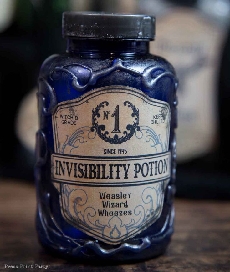 a blue jar sitting on top of a wooden table