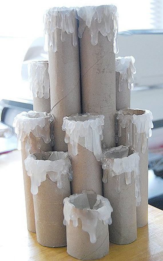 several rolls of toilet paper with icing on them sitting on a table next to a keyboard