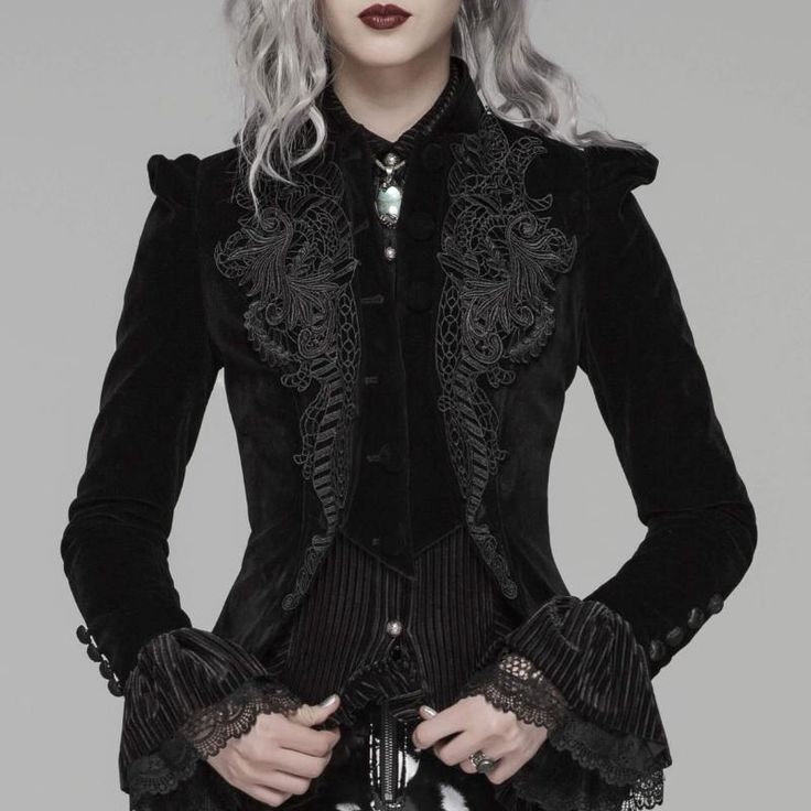 Steampunk jacket: go for the vintage look with this gothic jacket! Check your measurements, if you are between two sizes, take the larger one. Elevate your outfit with our Romantic Gothic Steampunk jacket. This black velvet jacket blends Victorian elements with a modern twist. It features a high buttoned collar, puffed shoulders, and intricate embroidery at the front. The back of the jacket has a white ribbon for a customizable fit. This versatile jacket complements Gothic, Steampunk, or vintage chic outfits with ease. Embrace elegance and style - get your Romantic Gothic Steampunk jacket now! Vintage Chic Outfits, Armadura Cosplay, Steampunk Vest, Steampunk Jacket, Mode Steampunk, Gothic Coat, Gothic Jackets, Gothic Lace, Black Velvet Jacket