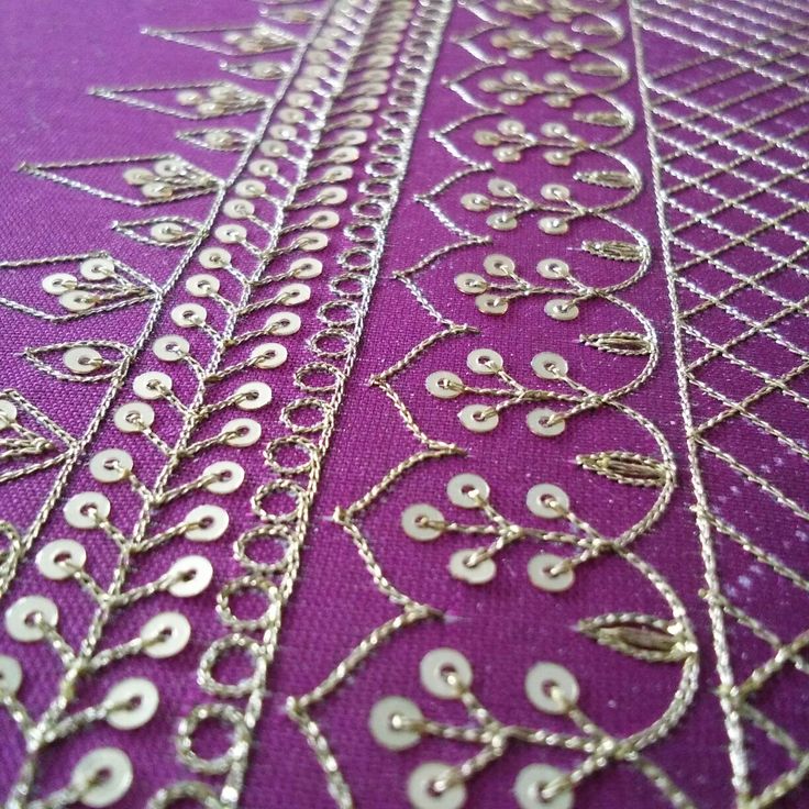 a purple table cloth covered in lots of silver chains