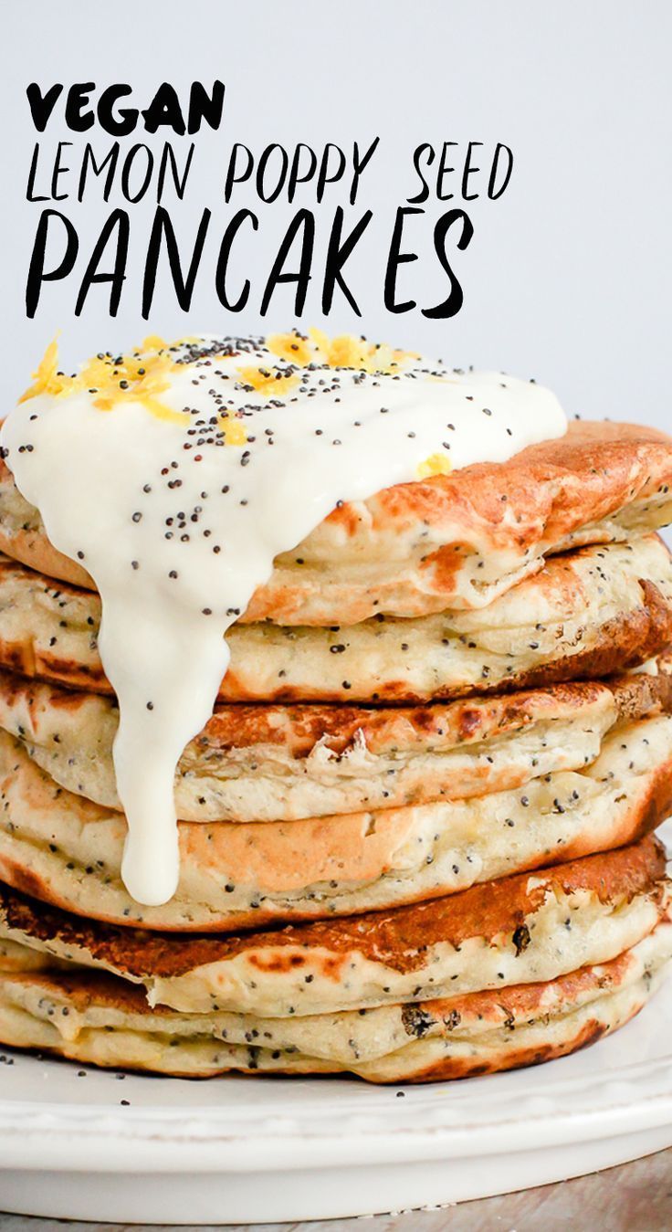 a stack of pancakes covered in lemon poppy seed and drizzled with white icing