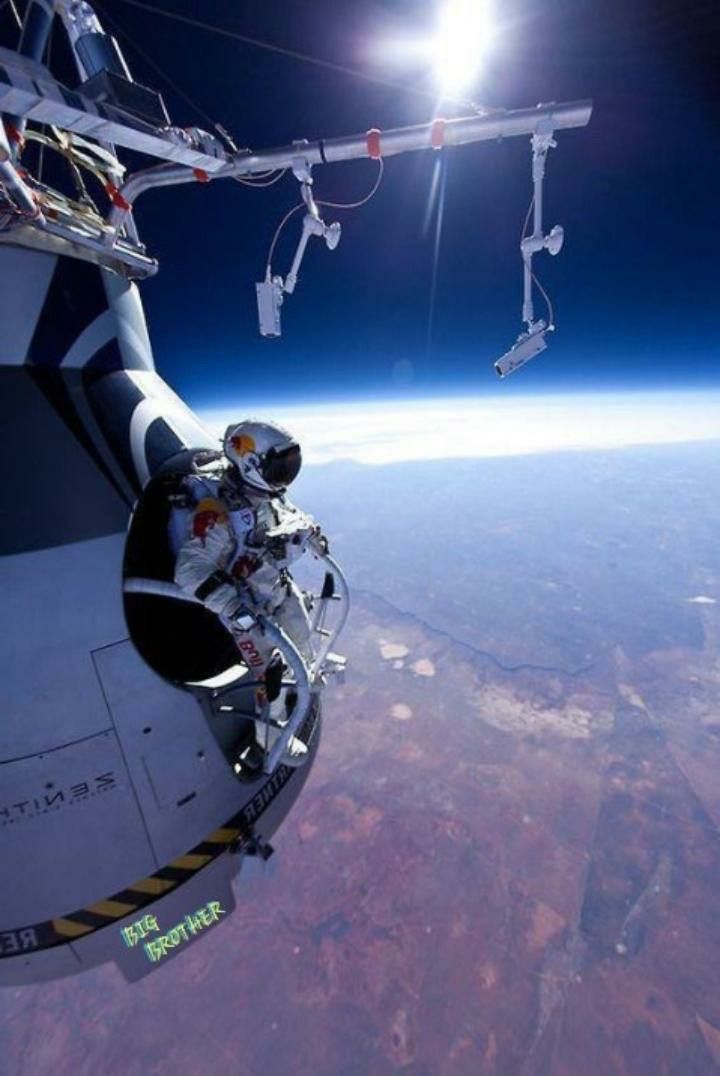 an astronaut is suspended in the air above earth