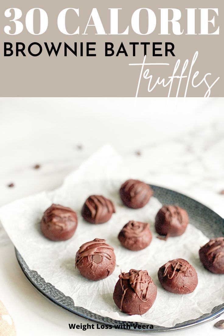 chocolate brownie batter truffles on a plate with the words, 30 calorie brownie batter truffles