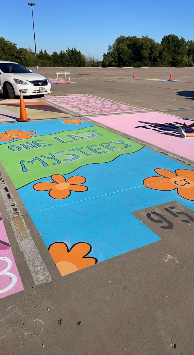 the parking lot is painted with flowers and numbers