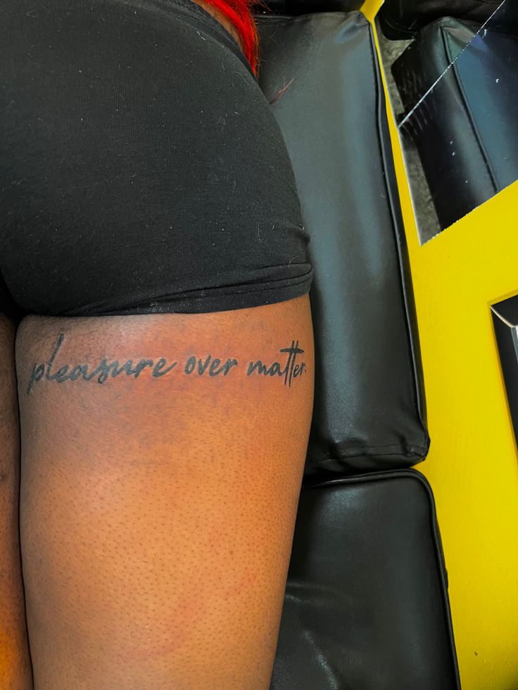 a woman's back with the words pleasure over math written on her left leg