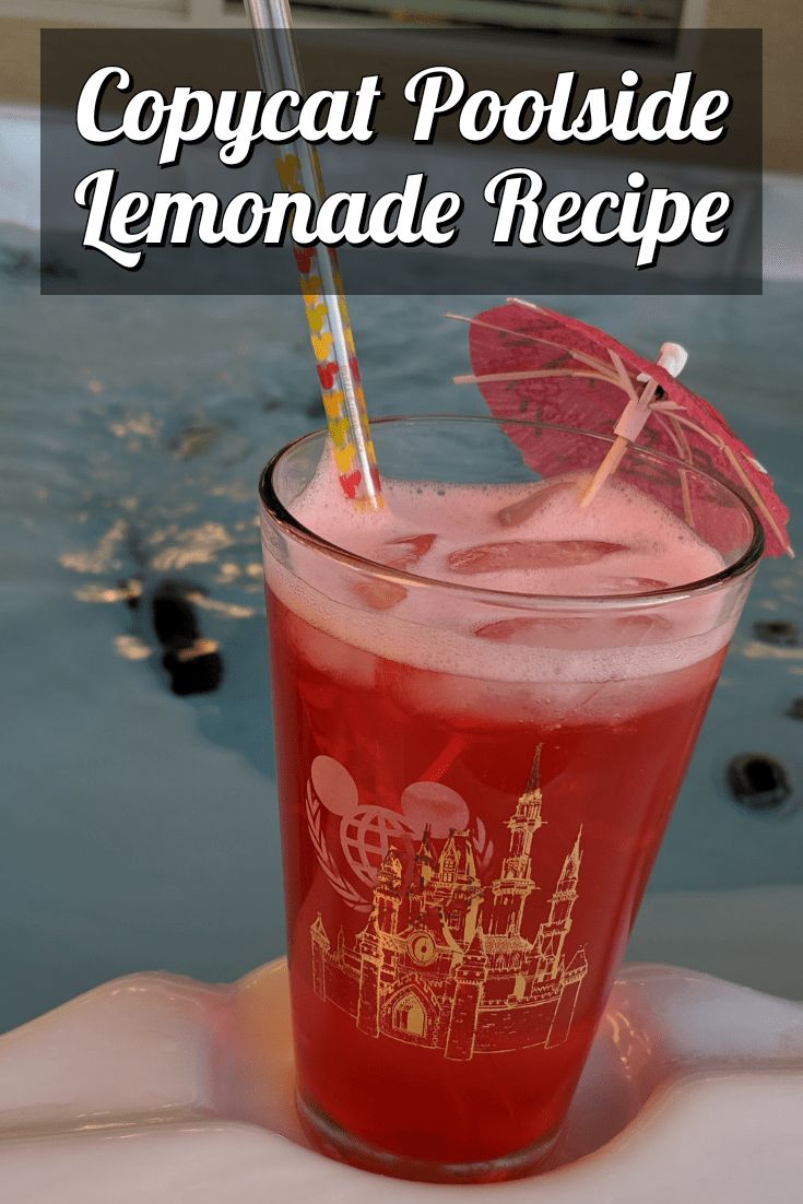 a red drink in a tall glass with an umbrella sticking out of it's top