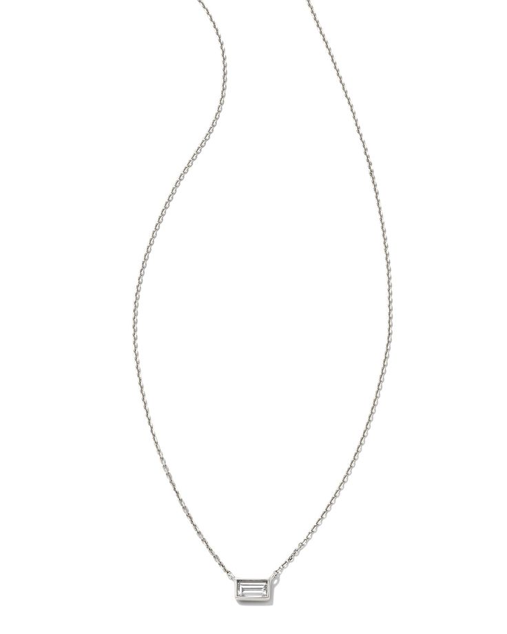 The Isabella 14k White Gold Pendant Necklace in White Diamond is the classic sophistication you’re looking for in a piece of jewelry. Crafted with the best materials, including a .075 carat baguette diamond, this everyday essential can be worn for a lifetime. We have taken steps to ensure that, when applicable, our diamonds are conflict free by requiring our suppliers to comply with the Kimberley Process. Metal 14k White Gold Rhodium Plated Material White Diamond Diamond Quality Diamond H SI Size 15” Chain with 2” Extender, 0.17"W X 0.11"L Pendant Carat Weight: 0.075Due to the one-of-a-kind nature of the medium, exact colors and patterns may vary slightly from the image shown. | Kendra Scott Isabella 14k White Gold Pendant Necklace in White Diamond | Diamonds White Gold Pendant Necklace, White Gold Pendant, Stone Pendant Necklace, Yellow Gold Pendants, Baguette Diamond, Gold Pendant Necklace, Quality Diamonds, Gold Earrings Studs, Gold Hoop Earrings