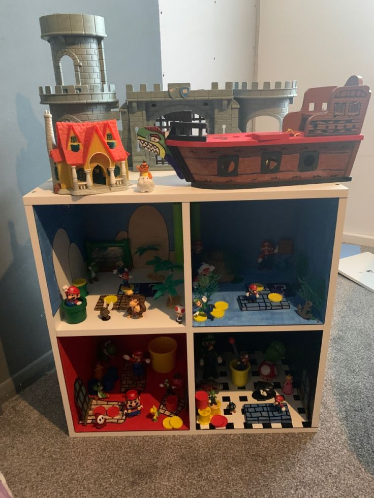 a toy shelf filled with toys on top of a carpeted floor