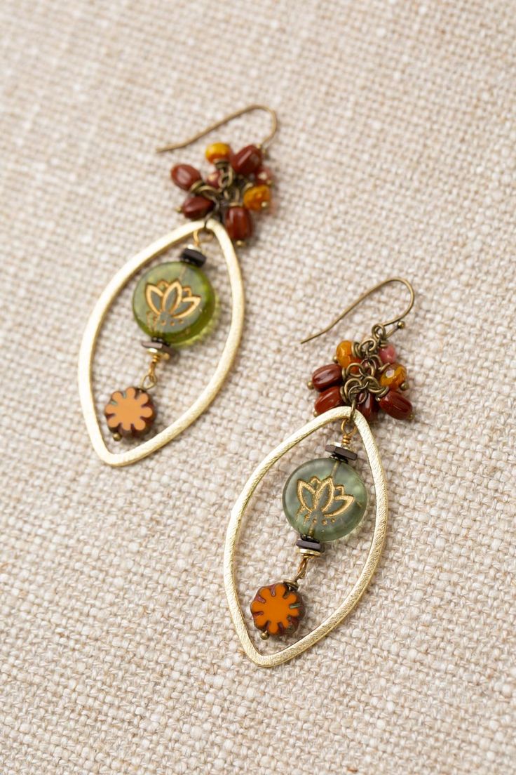 The Czech Glass Collection offers a varied selection of handcrafted earrings, including this eye-catching statement design. Antique Brass (Lead & Nickel Free) Czech Glass 2.75" with antique brass ear wires We hand select our natural materials, thus there may be slight variations in color and/or size that will not detract from the overall aesthetic. Our unique handcrafted designer jewelry for women is made in America, each design created individually in our personal design studio in Floyd, VA USA Bohemian Amber Teardrop Jewelry, Bohemian Teardrop Amber Jewelry, Handmade Czech Glass Bronze Jewelry, Handmade Bronze Jewelry With Czech Glass, Amber Colored Nickel Free Czech Glass Jewelry, Nickel-free Amber Czech Glass Jewelry, Amber Czech Glass Nickel-free Jewelry, Gold Handmade Nature-inspired Jewelry, Nickel-free Round Earthy Jewelry