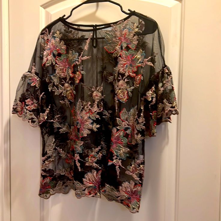 By Sundance Size Woman’s Large 46” At Bust And 24” Length 100% Polyester Scalloped Hem 1/2 Sleeves Slightly Ruffled Beaded & Embroidered Embellishments Throughout, Front And Back For A Beautiful Classy Elegant Woman Like You! Multicolor Sheer Tops For Party, Multicolor Sheer Top For Party, Multicolor Sheer Party Tops, Pink Floral Print Top For Evening, Pink Floral Print Evening Top, Floral Embroidered Short Sleeve Blouse For Party, Elegant Multicolor Tops With Floral Embroidery, Multicolor Lace Tops For Spring, Spring Night Out Blouse With Floral Embroidery