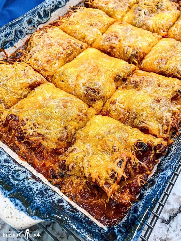 a casserole dish filled with meat and cheese