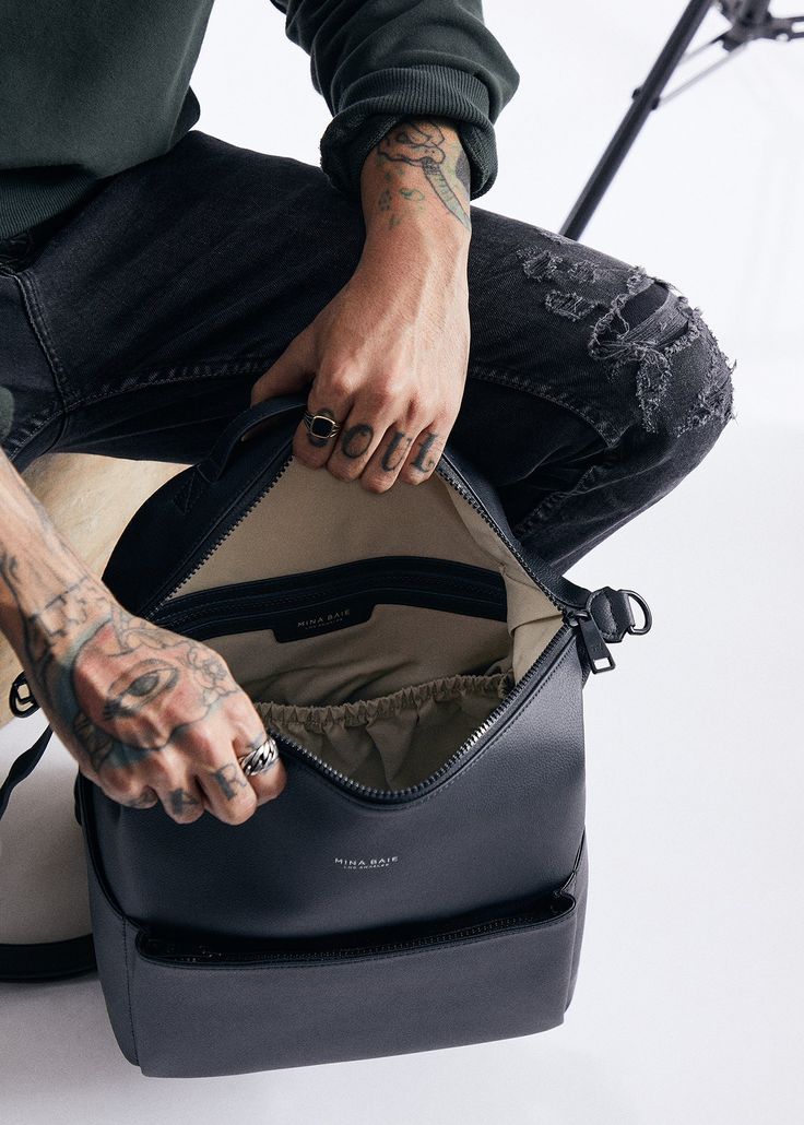 Stevie Midi is gender-neutral, edgy, and has the space to hold just the essentials. From a hike to the store, from work to the park, her eight internal pockets and easy-to-clean microfiber vegan leather make her the perfect bag to take just about anywhere. This ‘just right size’ is ideal for the mama who’s ready to downsize, and who likes nice things yet doesn’t want to fear the rough & tumble. Stevie’s all about options – her backpack converts to a shoulder strap, and her intuitive internal org Functional Leather Softback Backpack, Functional Leather Backpack With Adjustable Strap For Everyday, Functional Leather Softback Backpack For Daily Use, Everyday Leather Backpack With Functional Pockets, Everyday Leather Backpack With Anti-theft Pocket, Trendy Commuting Backpack With Zipper Pocket, Trendy Backpack With Zipper Pocket For Commuting, Functional Leather Backpack For Daily Use, Modern Leather Backpack With Anti-theft Pocket