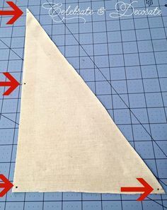 an image of a triangle on a cutting mat with arrows pointing to the right and left