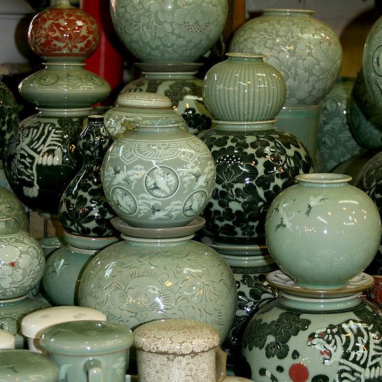 there are many vases on display together