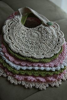 several crocheted purses stacked on top of each other