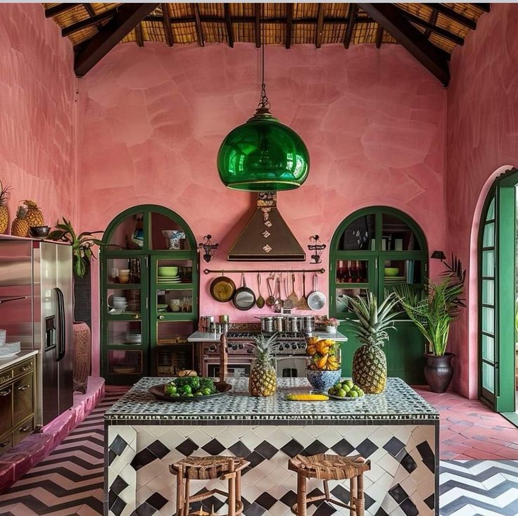 the kitchen is decorated in pink and green