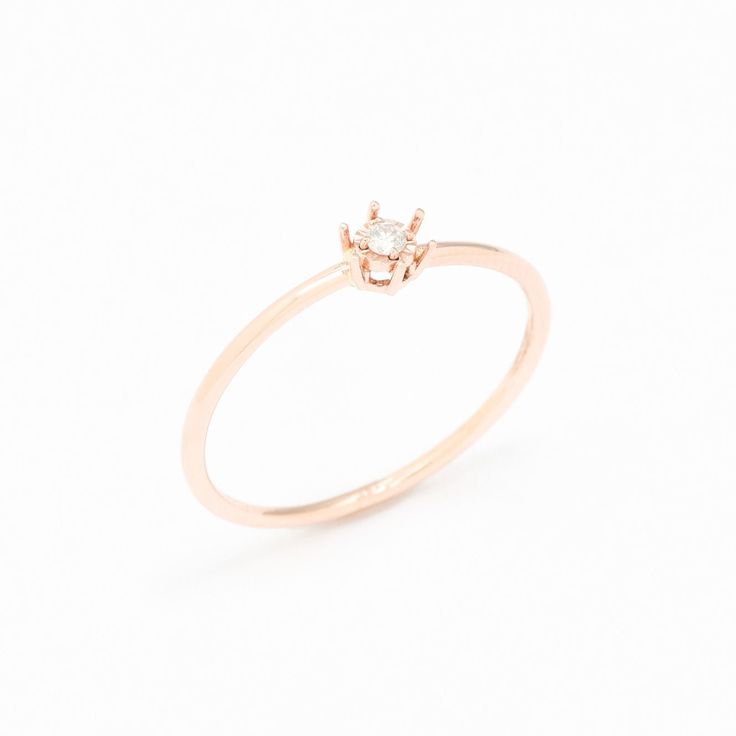 Dainty Diamond Rose Gold Ring set with Natural Diamond, size 2 millimeters diameter, 0.6 Carats.Solid 14k Rose Gold ☞ made to last.Click here for ☞ Solid Gold CollectionDiamond Details:• CERTIFIED Natural Diamond• Weight: 0.6 Carats• Dimensions: 2mm• Color: G• Clarity: I1• Cut: Very GoodSolid Gold Details:• 1 gram of 14k Solid Rose Gold• Dimensions: Band width ≈ 1mm, thickness ≈ 1mm• Lasts a lifetime - Perfect for everyday use (won’t tarnish)!*Final weight & dimensions depending on the chosen ri 14k Rose Gold Midi Promise Ring, Delicate Solitaire Rose Gold Stackable Rings, Rose Gold 14k Midi Promise Ring, Rose Gold Midi Rings Fine Jewelry, Dainty 14k Rose Gold Diamond Ring, Rose Gold Rings With Single Diamond In Round Band, Rose Gold Ring With Single Diamond In Round Band, Fine Jewelry 14k Rose Gold Midi Rings, Rose Gold Solitaire Midi Rings As Gift