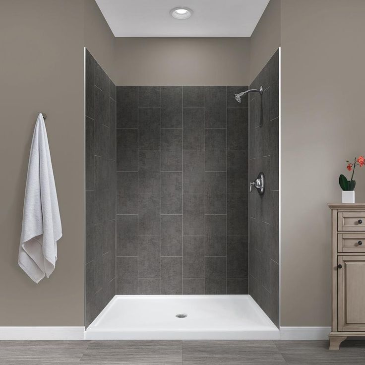 a walk in shower sitting inside of a bathroom