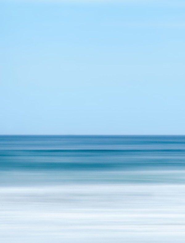 blurry photograph of the ocean and sky