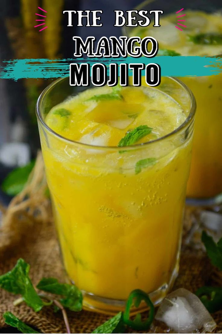 two glasses filled with mango mojito on top of a table