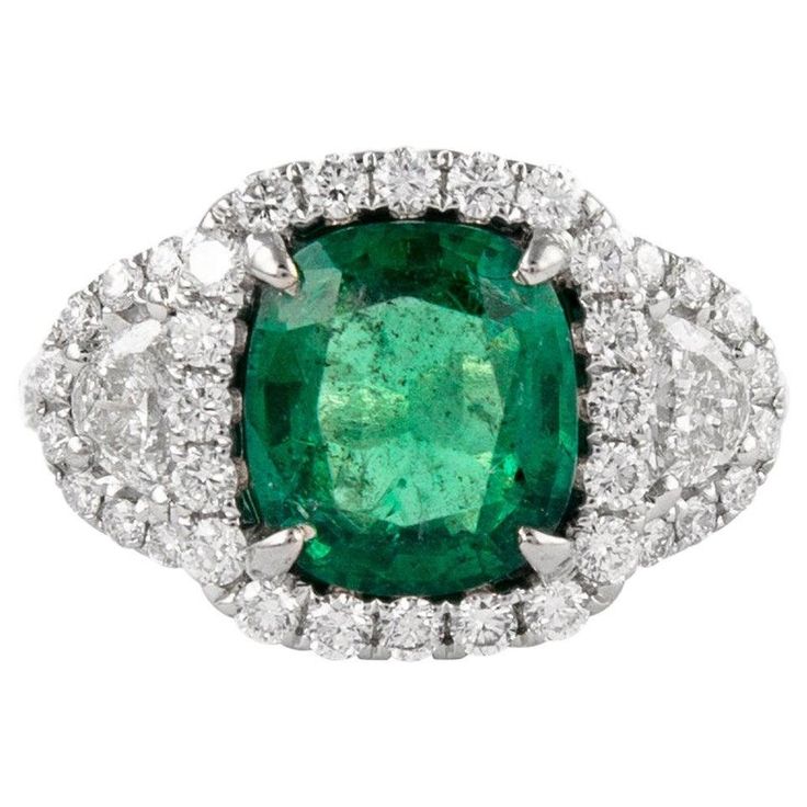 Stunning emerald and diamond three stone ring with halo. 3.67 carats total gemstone weight. 2.43 carat cushion emerald, apx F2. 2 half moons with 50 round brilliant diamonds, 1.24 carats. Approximately G/H color and VS-SI clarity. 18k white gold, 6.28 grams, current ring size 6.25, with milgrain and filigree work.  Accommodated with an up to date digital appraisal by a GIA G.G., once purchased, upon request. Please contact us with any questions. Thank you. Item Number R9360 Three Stone Engagement Rings Halo, Modern Diamond Jewelry, Ring With Halo, Diamond Three Stone Ring, Half Moons, Halo 3, Contemporary Engagement Rings, Modern Engagement Rings, Three Stone Diamond