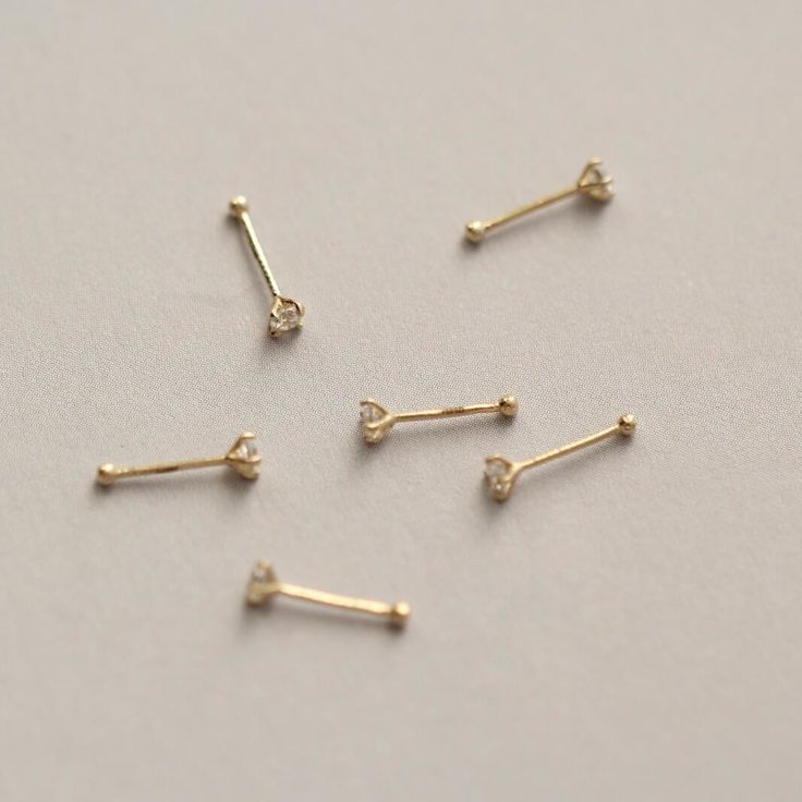 Style A tiny and cute 14K gold nose stud, without breaking the bank. You could never go wrong with such a classic design. It is a dazzling symbol of your personality. Metal It is made of 14K yellow gold. 14K gold contains 58.5% gold and 41.5% alloy. Compared to 10K, 18K, and 24K, it is the most popular choice, nearly 90% of all wedding rings and engagement rings sold in the United States consist of 14K gold. It’s durable and will not easily tarnish. Packaging It is ready as a gift! This 14K gold nose bone stud is made with love and will arrive in a jewelry box. Whether for yourself or for the one you love, it is an excellent choice. Dainty Prong Setting Nose Studs As Gifts, Dainty Yellow Gold Piercings With Single Diamond, 14k Gold Nose Studs With Prong Setting Gift, 14k Gold Prong Setting Nose Studs For Gift, Dainty Yellow Gold Nose Studs For Gift, Dainty Yellow Gold Nose Studs As Gift, Dainty Gold Piercing With Single Diamond, Minimalist Gold Piercings With Single Diamond, Dainty Gold Piercings With Birthstone