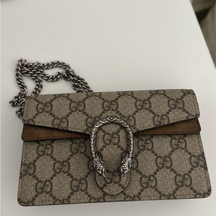 The Bag Is In Gorgeous Condition. Canvas Bag And Has Taupe Suede Detailing. No Scratches Or Marks:) Offers Accepted. Brown Gucci Crossbody Bag, Luxury Brown Shoulder Bag With Branded Hardware, Gucci Pouch Bag With Detachable Strap, Luxury Brown Bag With Silver-tone Hardware, Luxury Brown Bags With Silver-tone Hardware, Gucci Leather Clutch Shoulder Bag, Designer Brown Bags For Everyday Luxury, Gucci Beige Bags With Silver-tone Hardware, Designer Gucci Bag With Branded Hardware