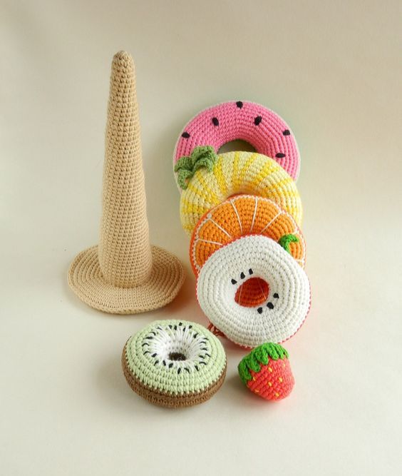 crocheted fruits and vegetables sitting next to each other